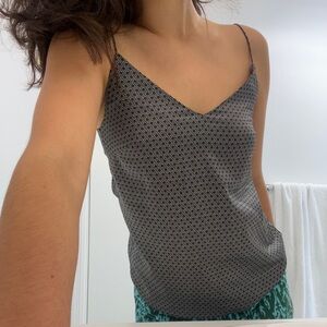 Black and white spaghetti strap silk blouse.